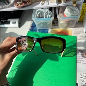 Black/white Valentino sunglasses with orange lenses